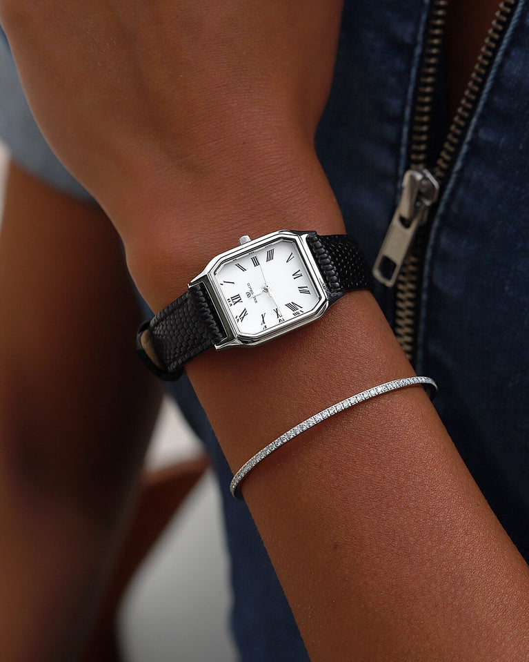 A square womens watch in Rhodium-plated 316L stainless steel with a black genuine leather strap from Waldor & Co. with white Diamond Cut Sapphire Crystal glass dial. Seiko movement. The model is Eternal 22 Varenna.