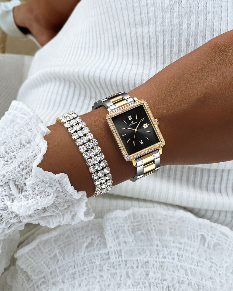 A 14k gold plated stainless steel chain in silver from Waldor & Co. One size. The model is Tennis Trio Chain Polished