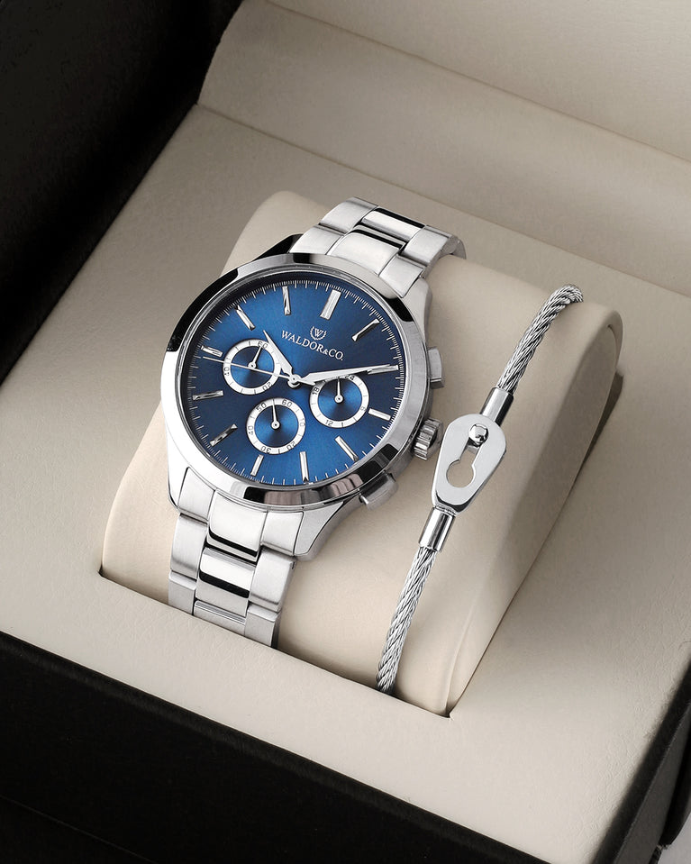 A round mens watch in rhodium-plated silver from Waldor & Co. with blue sunray dial and a second hand. Seiko movement. The model is Chrono 42 Capri 42mm.