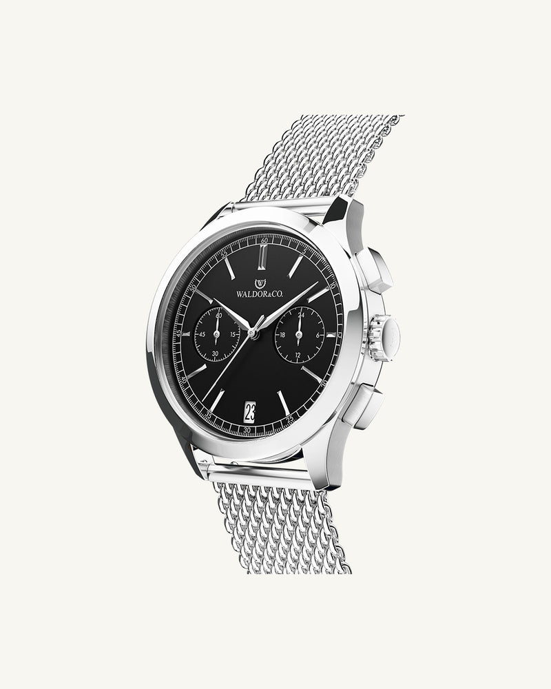 A round mens watch in rhodium-plated silver from Waldor & Co. with silver sunray dial and a second hand. Seiko movement. The model is Chrono 44 Sardinia 44mm.