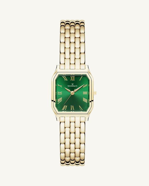 A square womens watch in 22k gold from Waldor & Co. with green Diamond Cut Sapphire Crystal glass dial. Seiko movement. The model is Eternal 22 Bellagio.