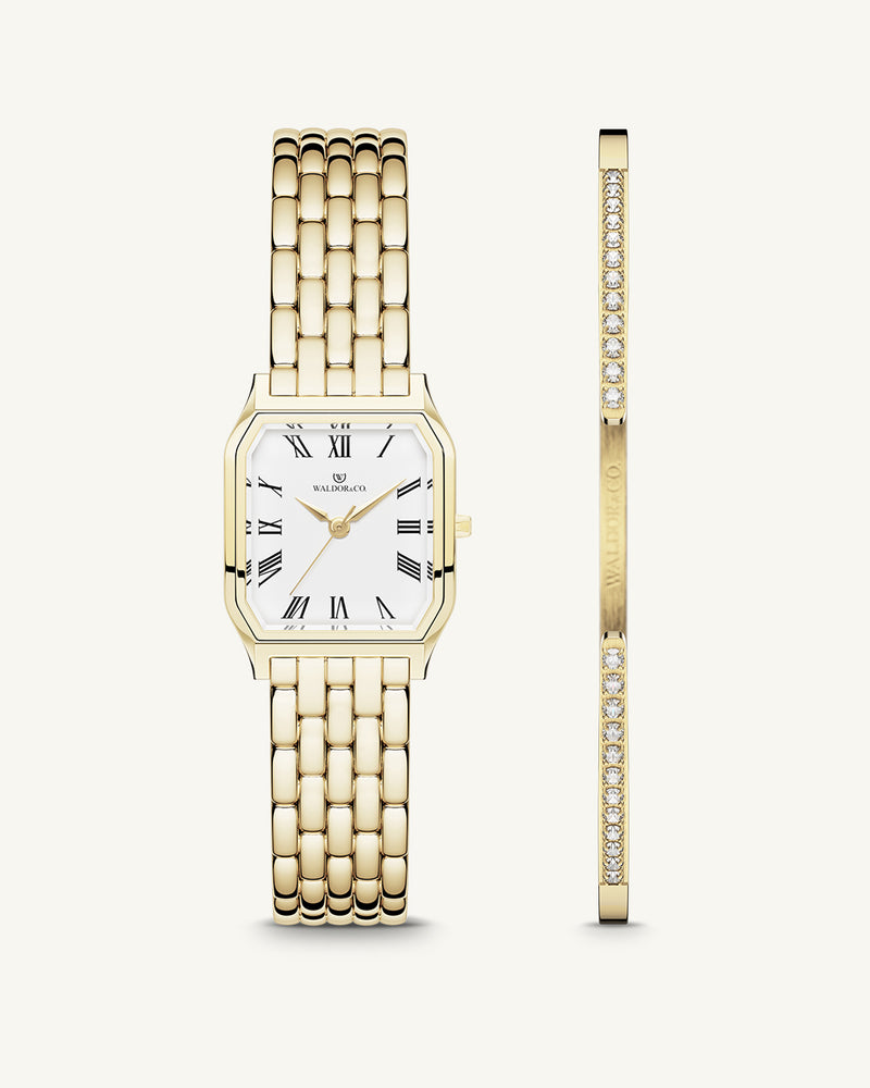 A square womens watch in 22k gold plated 316L stainless steel from Waldor & Co. with white Diamond Cut Sapphire Crystal glass dial. Seiko movement. The model is Eternal 22 Bellagio