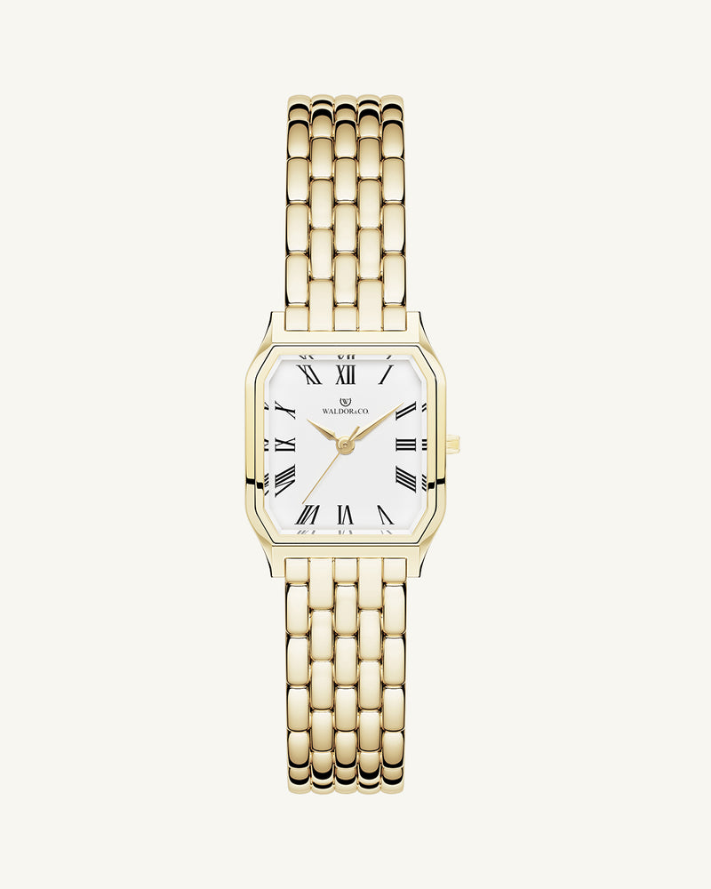 A square womens watch in 22k gold plated 316L stainless steel from Waldor & Co. with white Diamond Cut Sapphire Crystal glass dial. Seiko movement. The model is Eternal 22 Bellagio